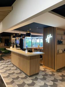 a kitchen with a counter in a room at Holiday Inn Clermont Ferrand Centre, an IHG Hotel in Clermont-Ferrand