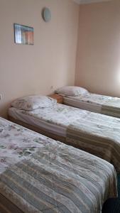 a room with two beds in a room at Hotelik Gościnny in Radzyń Podlaski