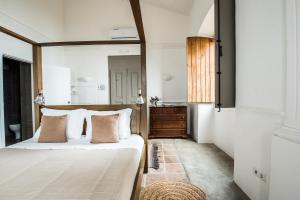a bedroom with a bed with a large mirror at Herdade do Vau in Serpa
