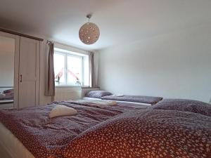 Posteľ alebo postele v izbe v ubytovaní Panoramatický apartmán Tatry