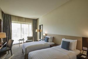 Postel nebo postele na pokoji v ubytování Safir Hotel Doha + 32 fotografií