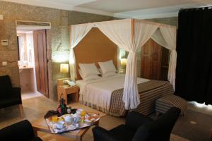Giường trong phòng chung tại Hotel Rural de Charme Maria da Fonte