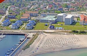 an aerial view of a beach with buildings and a harbor at Yachthafenresidenz-Wohnung-9310-900 in Kühlungsborn