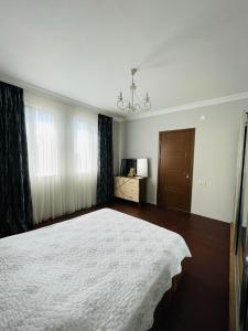 A bed or beds in a room at your house in batumi