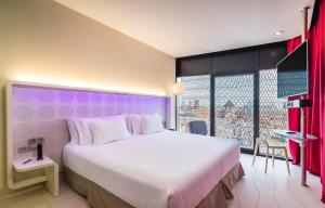 Säng eller sängar i ett rum på Barceló Raval