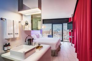 Säng eller sängar i ett rum på Barceló Raval +46 foton