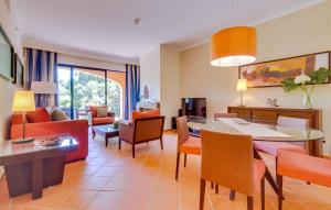 a living room with a dining and living room at AL - Apartamento Vila Sol F5 Top Floor in Quarteira