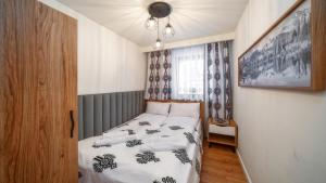 Posteľ alebo postele v izbe v ubytovaní Resorts D Białka Tatrzańska z sauną, Sun & Snow