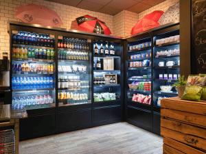 a grocery store with a large display of drinks at Mercure Amsterdam City Hotel in Amsterdam