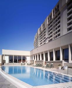a large swimming pool in front of a building at Hyatt Regency DFW International Airport in Dallas