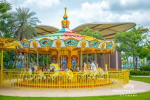 a brightly colored carousel at a park at Prince Manor Resort in Phnom Penh