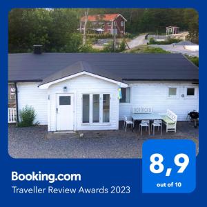 a white building with a table in front of it at House. 80m2, near Lake, with car charge. in Sommarbo