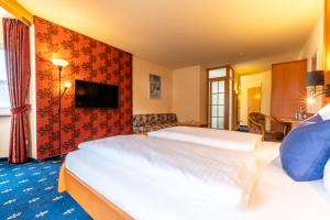 Postel nebo postele na pokoji v ubytování Hotel Tia Monte Nauders