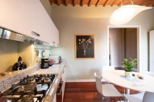 Kuchyňa alebo kuchynka v ubytovaní Casa della Luce Luxury