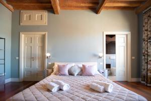 Posteľ alebo postele v izbe v ubytovaní Casa della Luce Luxury