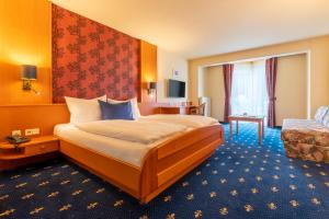 Postel nebo postele na pokoji v ubytování Hotel Tia Monte Nauders