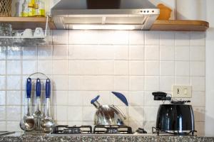 Kuchyň nebo kuchyňský kout v ubytování Casetta di Butia, Gelsomino Apartment