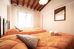 Postel nebo postele na pokoji v ubytování Casetta di Butia, Gelsomino Apartment