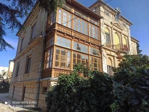a building with large windows on the side of it at Studio apartman Lea in Pula