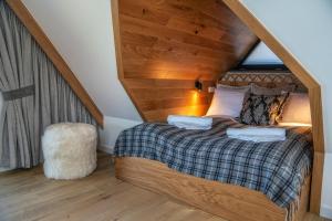 Posteľ alebo postele v izbe v ubytovaní Resorts D Białka Tatrzańska z sauną, Sun & Snow