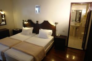 Postel nebo postele na pokoji v ubytování Hotel Sirius + 16 fotografií