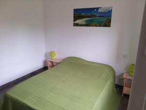Łóżko lub łóżka w pokoju w obiekcie Villa climatisée avec piscine