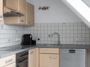 a kitchen with a sink and a dishwasher at Kunibert, 120 qm in Stockach
