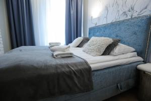 Posteľ alebo postele v izbe v ubytovaní M&K Apartamenty Morska Fala, Gdańsk - Wyspa Sobieszewska