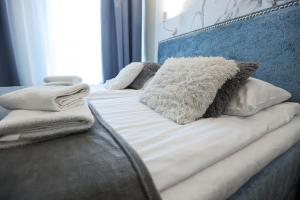 Posteľ alebo postele v izbe v ubytovaní M&K Apartamenty Morska Fala, Gdańsk - Wyspa Sobieszewska