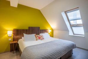 Postel nebo postele na pokoji v ubytování Logis Hôtel Chaptal, Amboise