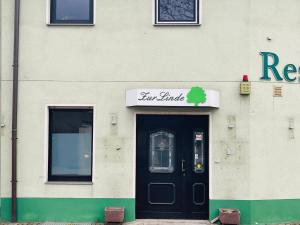 a building with a black door and a window at schönes Apartment - Netflix-Nespresso in Duisburg