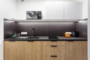 Kuchyňa alebo kuchynka v ubytovaní Z Widokiem Apartamenty Świerkowe 10