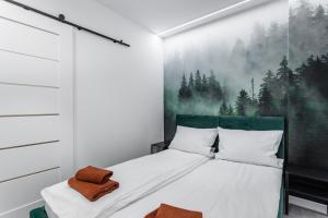 Posteľ alebo postele v izbe v ubytovaní Z Widokiem Apartamenty Świerkowe 10