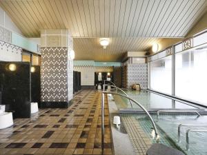 a room with a swimming pool in a building at Hotel Monterey La Soeur Osaka in Osaka +164 photos