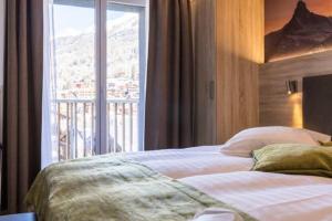 En eller flere senger på et rom på Hotel Bristol
