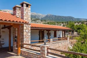 a stone house with a view of the mountains at ARADENA TRADITIONAL House 2 in Arádhaina