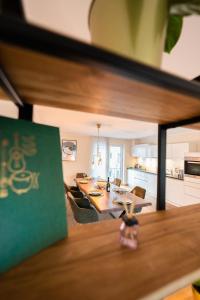 a kitchen and dining room with a table and chairs at -Zentrale Wohnung-Balkon-Desingerküche- in Bielefeld