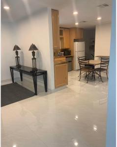 a kitchen and dining room with a table and chairs at room & private bathroom in Boca Raton