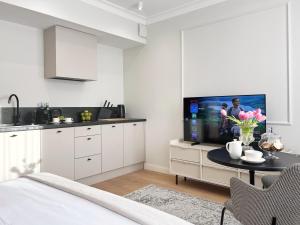 Telewizja i/lub zestaw kina domowego w obiekcie Kurkowa Apartments