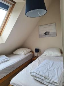 Posteľ alebo postele v izbe v ubytovaní Appartement au bord de mer