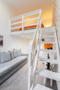 a living room with a bunk bed and a couch at The right choice studio apartments in Budapest