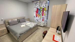 Letto o letti in una camera di City SMART
