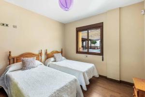 Posteľ alebo postele v izbe v ubytovaní Villa Ana Bella