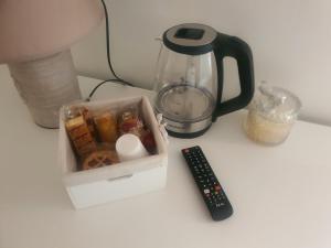 a table with a blender and a remote control at G&G Home in Cosenza