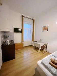 Televízia a/alebo spoločenská miestnosť v ubytovaní A3 Parliament Sunflower Cozy Apartment