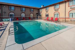 a swimming pool in front of a building at Red Roof Inn St George, UT - Convention Center in St. George