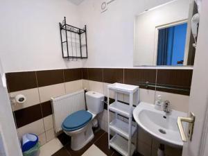 a bathroom with a toilet and a sink at A4 Parliament Sunflower Cozy Apartment in Budapest