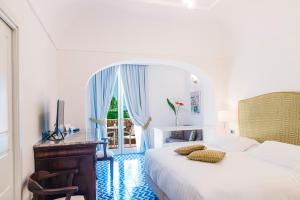 Llit o llits en una habitació de San Montano Resort & Spa