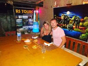 a man and a woman sitting at a table at Rosa Shashi Cabanas in Galle