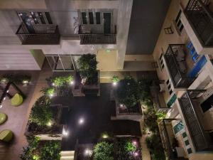 an overhead view of a courtyard with plants and lights at Homey-feel Studio Unit @ Lafayette Park Square Condominium in Iloilo City